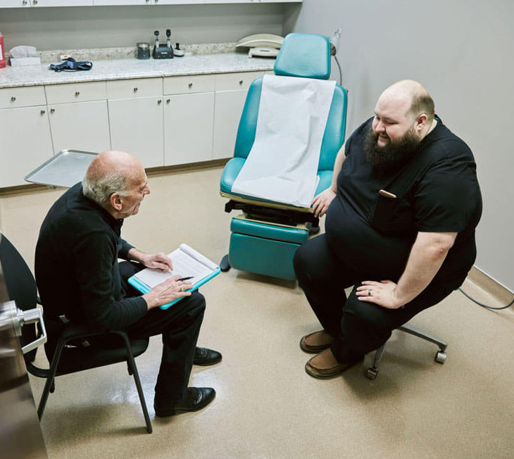 man sitting with patient